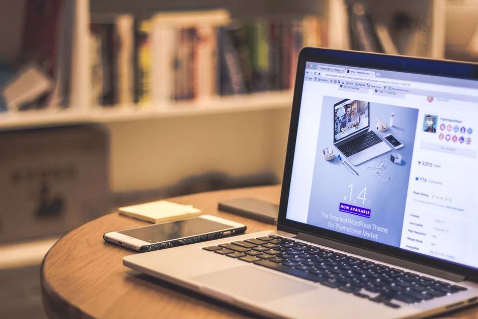 A modern workspace featuring a laptop, tablet, and smartphones, perfectly suited for tech and freelance work.